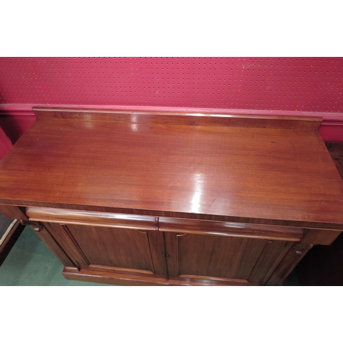 4222 - A Circa 1860 mahogany chiffonier, the raised back over carved corbels and two cushion frieze drawers... 