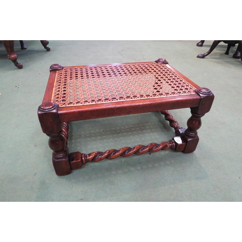 4240 - A Victorian walnut stool with cane seat on turned legs united by barley-twist stretchers, 22cm tall ... 