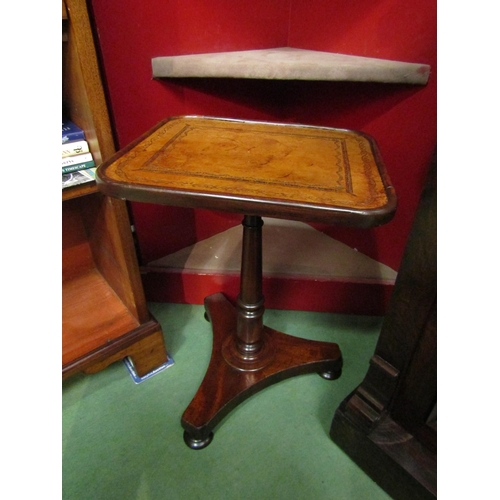 4251 - A 19th Century mahogany occasional wine/lamp table over a turned column and tri-form base on turned ... 