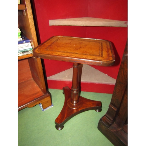 4251 - A 19th Century mahogany occasional wine/lamp table over a turned column and tri-form base on turned ... 