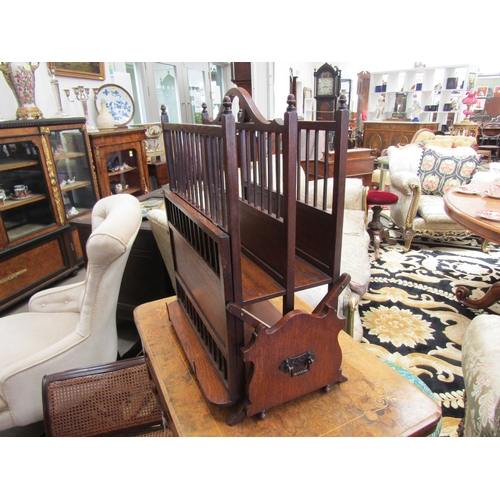 4256 - A circa 1900 Arts & Crafts multi-functional oak two section Canterbury with turned 