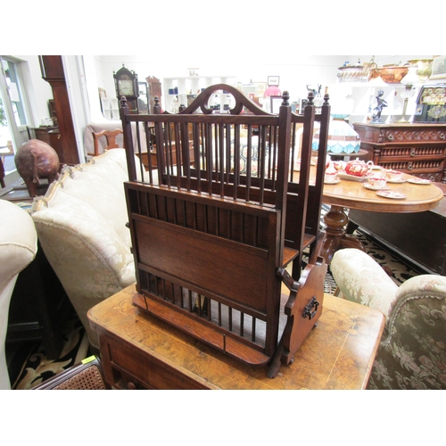 4256 - A circa 1900 Arts & Crafts multi-functional oak two section Canterbury with turned 