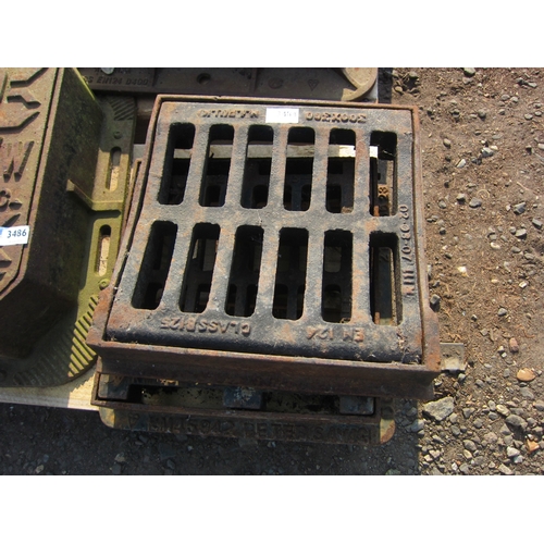 3484 - Two cast drain covers with frames