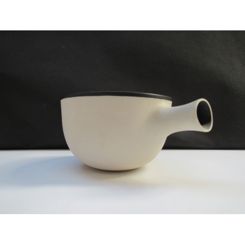 7085 - NICHOLAS HOMOKY (b.1950) An early white porcelain spouted handle bowl with black rim and spout inter... 