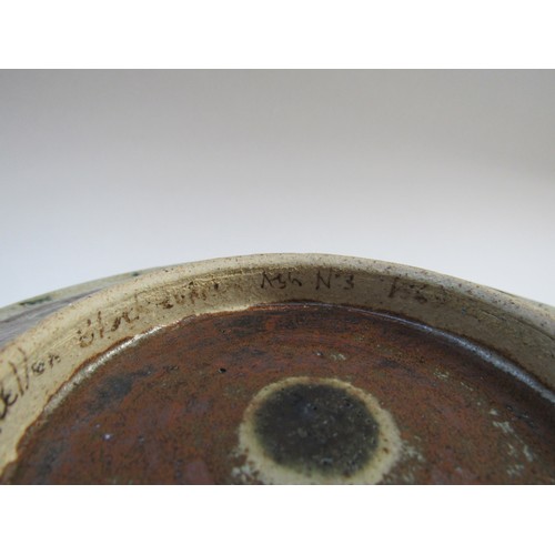 7073 - ERIC JAMES MELLON (1925 - 2014): An early studio pottery plate with ash glaze dot and line detail, s... 