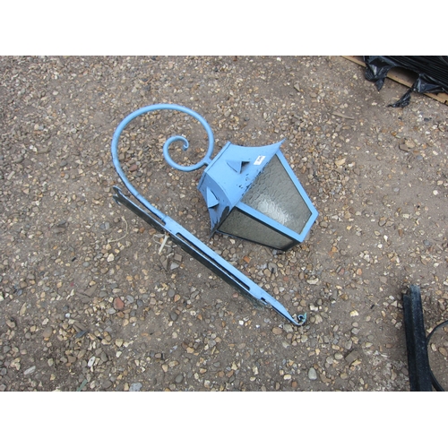 3540 - A blue painted wrought iron wall light with bracket