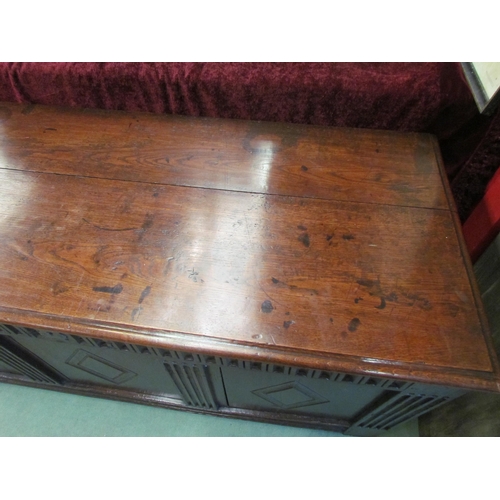 4021 - A 17th Century pegged oak three panelled coffer with carved muntins and lozenge panels on stile feet... 