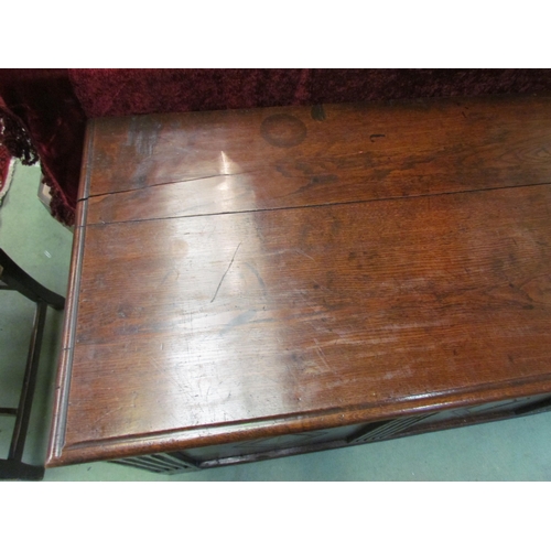 4021 - A 17th Century pegged oak three panelled coffer with carved muntins and lozenge panels on stile feet... 