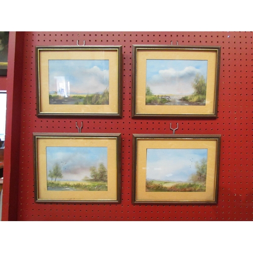 4089 - Four oil paintings depicting rural landscape scenes including windmill and rivers, oak framed and gl... 