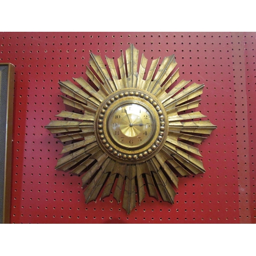 4101 - An early 20th Century gilt wood sunburst wall clock marked Made in France