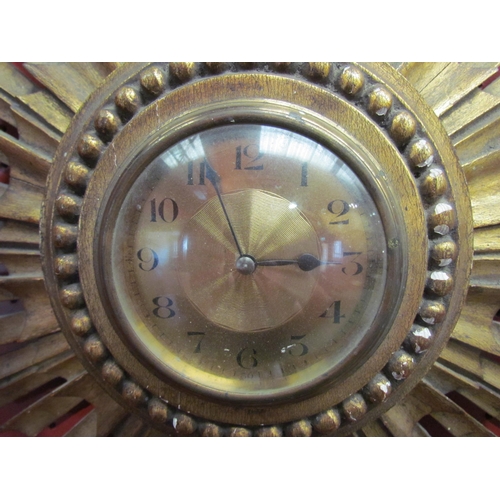 4101 - An early 20th Century gilt wood sunburst wall clock marked Made in France