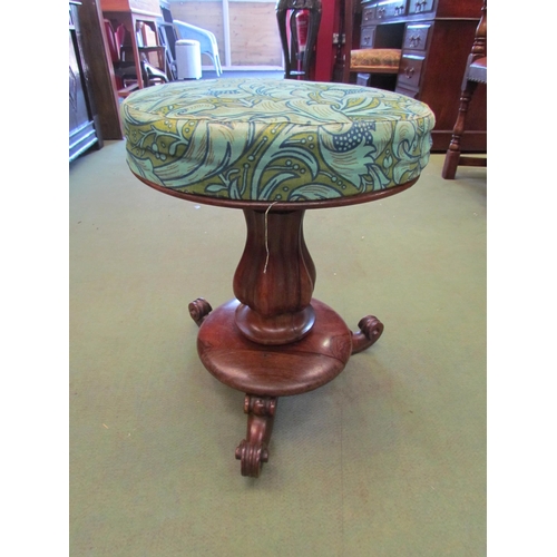 4113 - A Victorian mahogany piano stool with needlepoint seat, fluted column to scroll feet, split to base