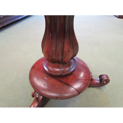 4113 - A Victorian mahogany piano stool with needlepoint seat, fluted column to scroll feet, split to base