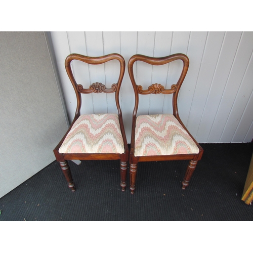 4123 - A pair of William IV rosewood dining chairs, scroll carved back support