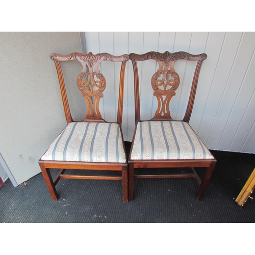 4124 - A pair of Georgian mahogany Chippendale style chairs with carved backrest on chamfered square legs u... 