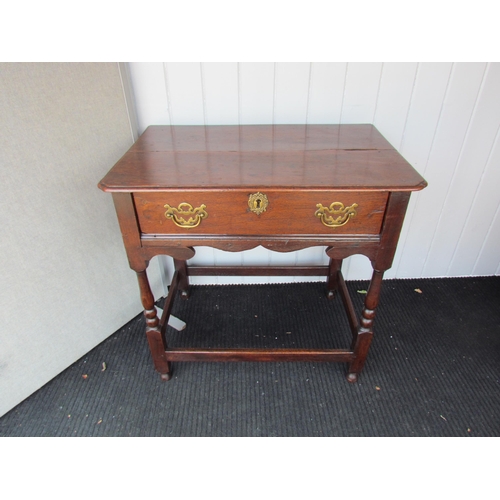 4125 - An 18th Century oak side table, the two plank top with pinched corners over a single drawer and shap... 