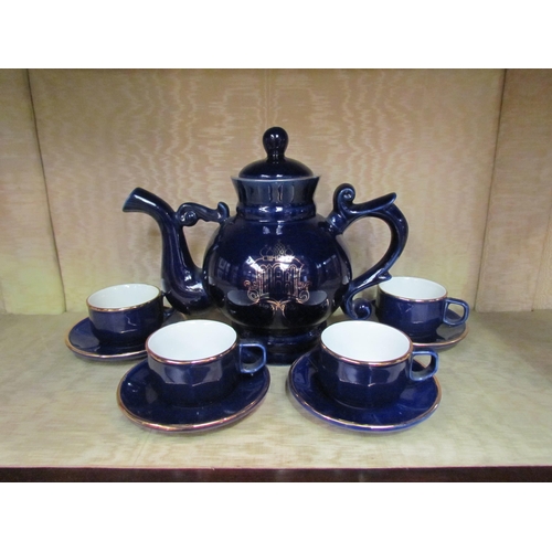 4139 - A set of four Martell Cognac cobalt and gilt cups and saucers with a cobalt and gilt Russian teapot