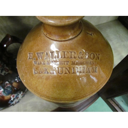 4141 - A stoneware flagon (H. Waller & Son, Wine and Spirit Merchant, Saxmundham) together with a stoneware... 