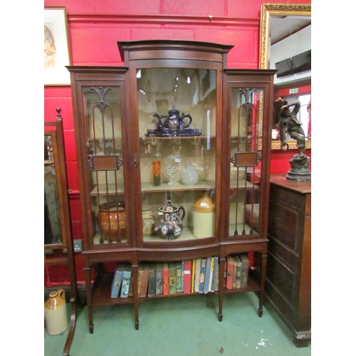 4143 - An Edwardian crossbanded mahogany glazed cabinet with a bow front glazed single door on spade foot s... 