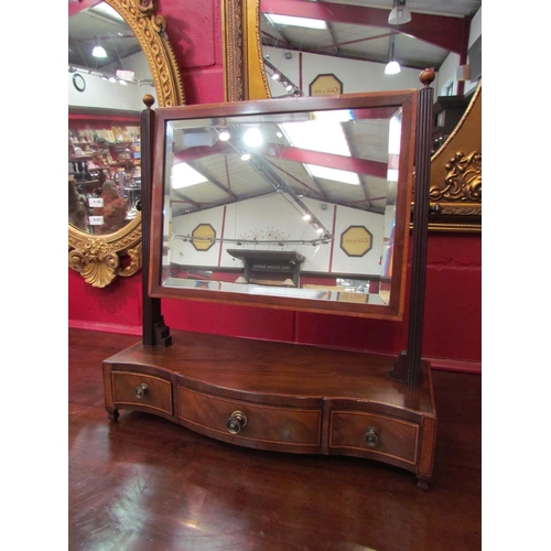 4152 - An Edwardian crossbanded mahogany toilet mirror, the bevelled edge mirror and finial supports on a s... 