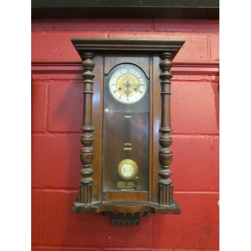 4159 - A 20th Century mahogany cased wall clock with enamel face, R & A on pendulum, with key, door hinge a... 