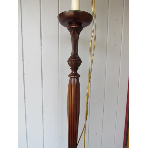 4160 - A Georgian style mahogany lamp standard with turned and reeded/carved decoration on a circular base