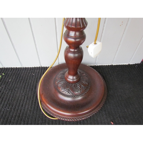 4160 - A Georgian style mahogany lamp standard with turned and reeded/carved decoration on a circular base