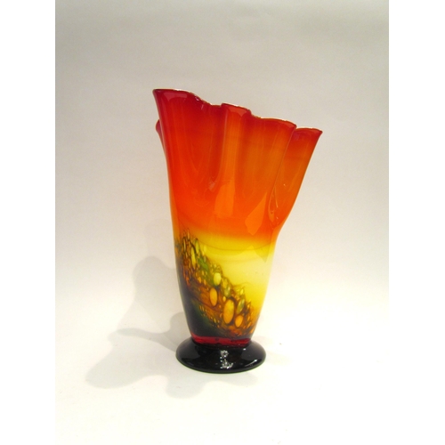 4173 - An Art glass vase of frilled trumpet form in oranges, yellow and blue, 28cm tall