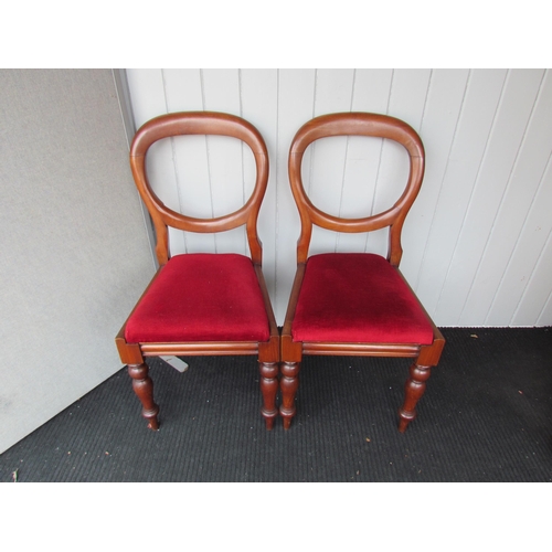 4186 - A set of six mahogany balloon-back dining chairs on turned and tapering fore legs