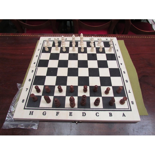 4194 - A wooden chessboard with chess set     (R) £10