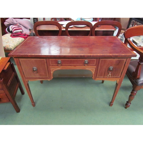 4195 - A reproduction mahogany chequered inlaid three drawer side table with lion mask handles, on tapering... 