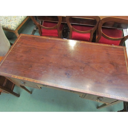 4195 - A reproduction mahogany chequered inlaid three drawer side table with lion mask handles, on tapering... 