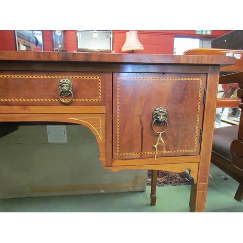 4195 - A reproduction mahogany chequered inlaid three drawer side table with lion mask handles, on tapering... 