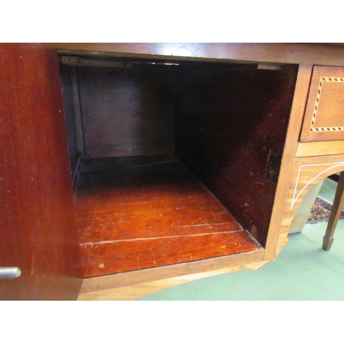 4195 - A reproduction mahogany chequered inlaid three drawer side table with lion mask handles, on tapering... 