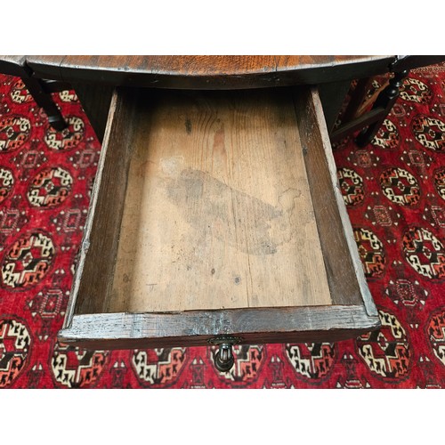 4126 - A Charles II pegged oak gate-leg oval top dining table, the rising leaves over two end drawers and b... 