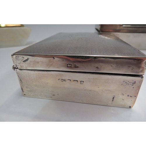 4335 - Four silver boxes and cigarette cases together with a Ronson agate table lighter