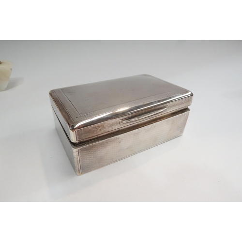 4335 - Four silver boxes and cigarette cases together with a Ronson agate table lighter