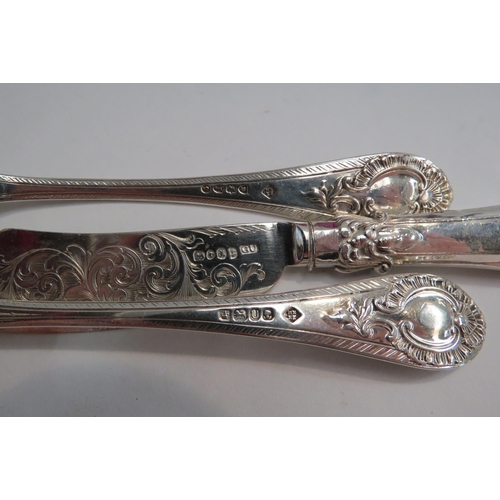 4336 - A Victorian ornate silver Christening spoon and fork (maker's mark RM/EH).  London 1884 and Sheffiel... 