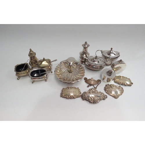 4341A - A selection of silver including decanter labels, Shell dish stamped Sheffield, mustard pot stamped L... 