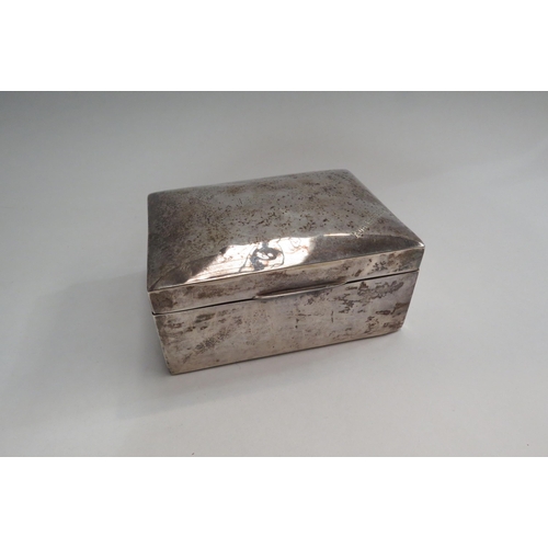 4352 - A George V silver cigarette box, the lid engraved with initials and dated 1920