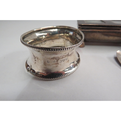 4354 - A silver double stamp case, silver napkin ring and spoon bowl