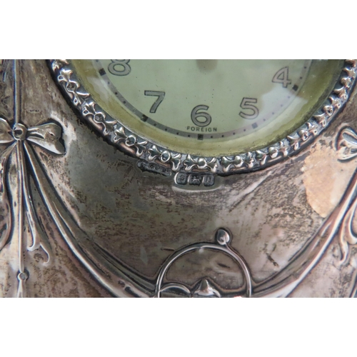 4358 - A silver fronted Art Nouveau timepiece, 14.5cm tall