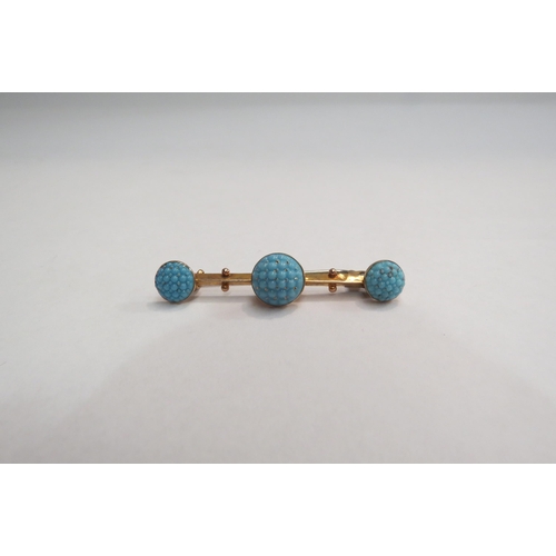 4369 - A 9ct gold turquoise set bar brooch.  Approximately 2g