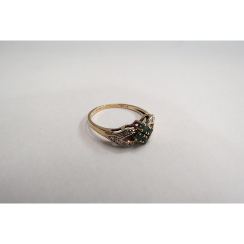 4403 - A 9ct gold, emerald and diamond set ring.  Approximately 1.7g, size O