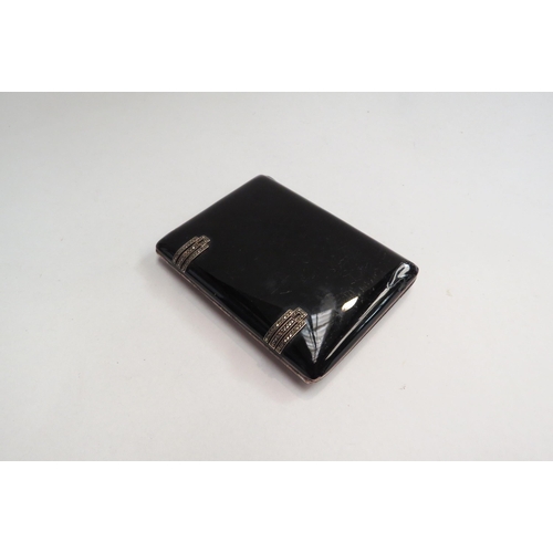 4420 - An Art Deco style silver cigarette case with black enamel and marcasite decoration.  Weight approxim... 