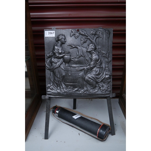 2107 - A Georgian cast iron stove back depicting jesus and mary magdolene on cast iron easel