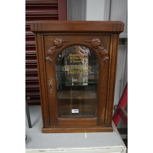 2230 - A glass display cabinet with later applied Cadburys Chocolate lettering   (R) £150