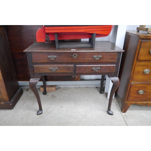 2220 - A Georgian oak low boy, two small over one long drawers, cabriole legs and brass handles