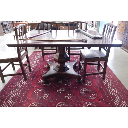 2203 - A Victorian mahogany dining table with 4'sq top on single tulip turned base, top a/f   (R) £0