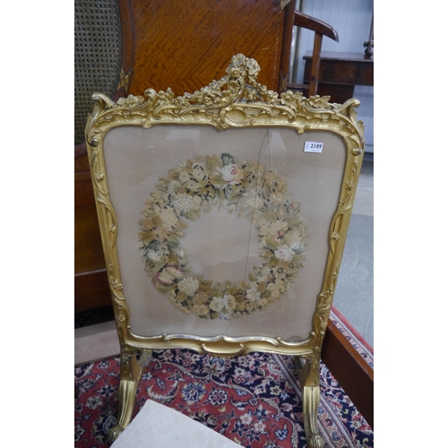 2227 - A French style gilt and gesso fire screen silk work panel, glass cracked   (R) £10